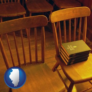 wooden chairs and hymnals in an old church building - with Illinois icon