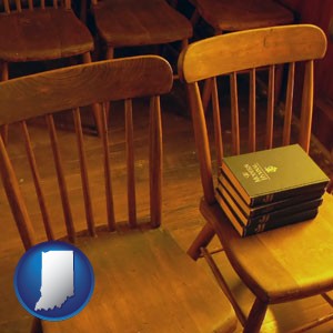 wooden chairs and hymnals in an old church building - with Indiana icon