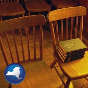 wooden chairs and hymnals in an old church building - with New York icon