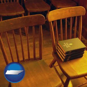 wooden chairs and hymnals in an old church building - with Tennessee icon