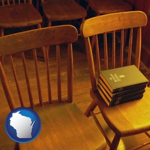 wooden chairs and hymnals in an old church building - with Wisconsin icon